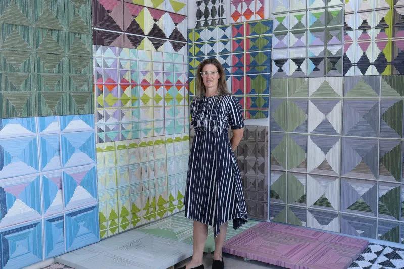 Jean Alexander Frater Stands In Front An Installation Of Her Painintgs 