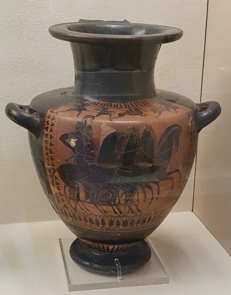 Hydria With A Depiction Of A Four-Horse Chariot, A Charioteer And A Hoplite, With A Battle Scene On The 
